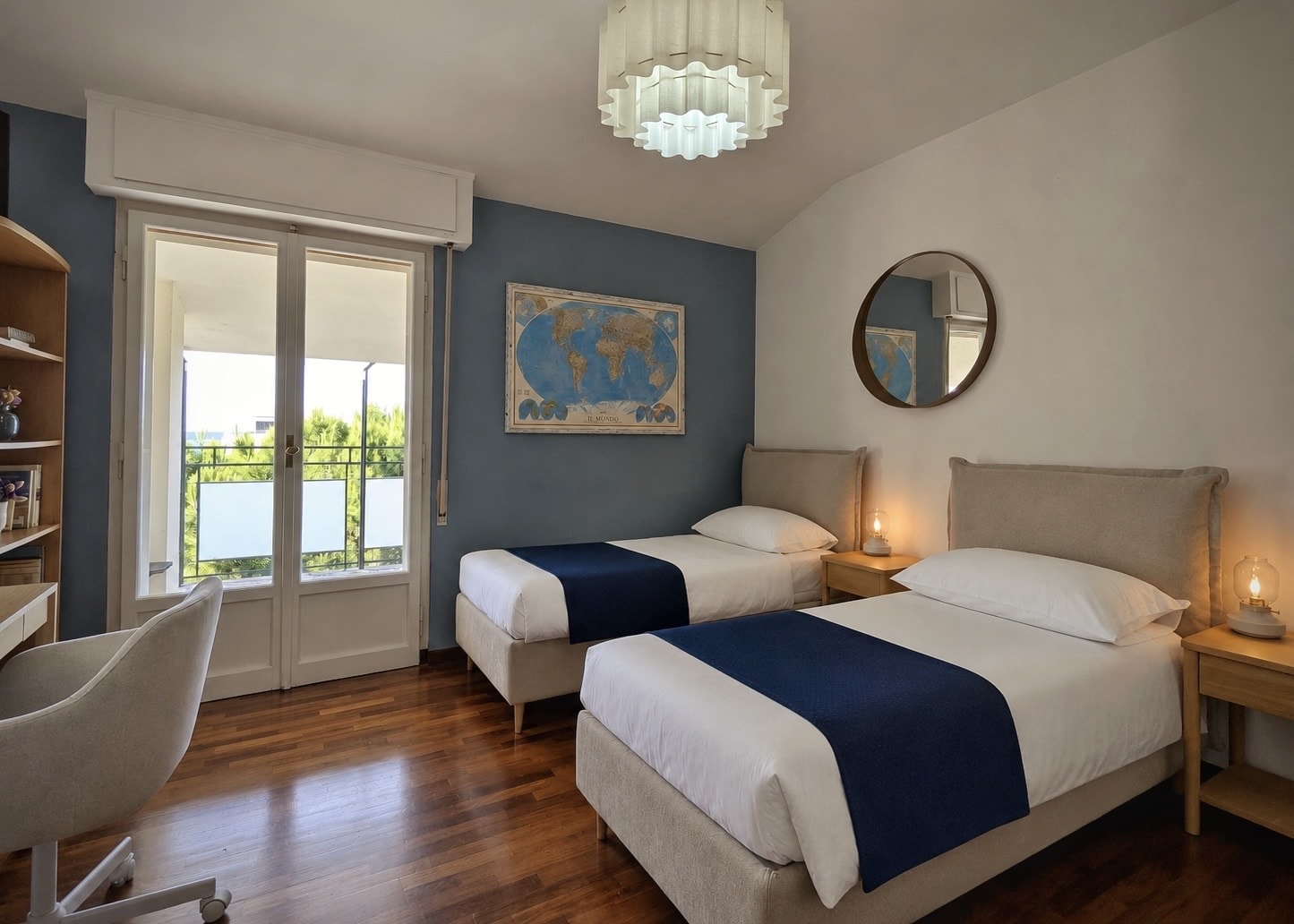 Twin beds beneath a sky-blue feature wall, with balcony access